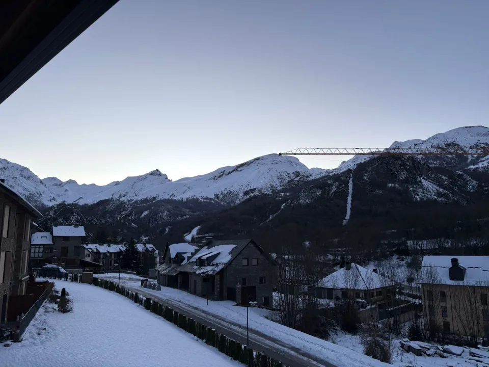 Winter in Panticosa from the window. A view of the village and mountains that invites you to enjoy winter at your own pace.