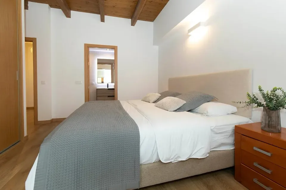 Bedroom with bathroom access. A bathroom beside the bedroom adds convenience to your stay.